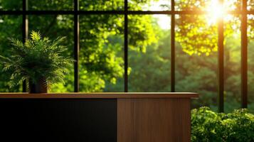 modern office interior featuring wooden desk and potted plant, illuminated by sunlight streaming through large windows, surrounded by lush greenery photo