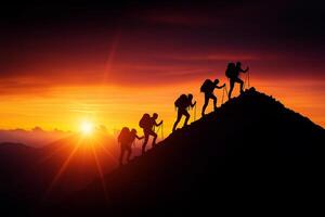 Climbers silhouetted against vibrant sunset, showcasing teamwork and determination on mountain ascent. scene captures spirit of adventure and perseverance photo