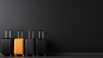 Travel suitcases in various sizes, including vibrant orange one, are lined up against dark wall, showcasing modern and stylish design photo