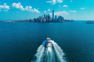 Aerial view of boat navigating through blue waters near city skyline. vibrant scene captures essence of urban life and leisure on water photo