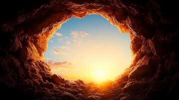 Cave entrance with rock formations and beautiful sunset view. warm sunlight illuminates cave, creating serene and tranquil atmosphere photo