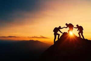 Helping each other climb mountain at sunset, showcasing teamwork and determination. silhouettes of climbers against vibrant sky symbolize support and achievement photo