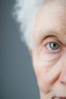 Close-up of an elderly person's face featuring soft-focus neutral tones and abstract lighting, highlighting the beauty of age and experience, with ample space for creative text integration photo