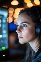 In a dimly lit dispatch center, a dedicated female emergency call operator monitors an urgent fire call on her computer screen, with soft-focus emergency lights reflecting in the background photo