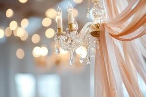 A lavish ballroom is filled with graceful golden streamers, casting shimmering reflections from antique chandeliers above. Soft candlelight enhances the romantic ambiance and space photo