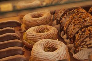 Display of various pastries at a local bakery during afternoon hours photo