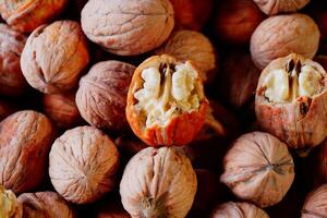 Fresh walnuts displayed in a market during harvest season photo