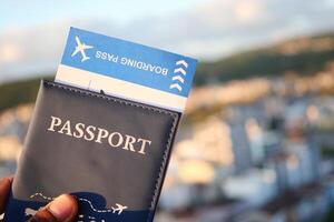 Preparing for adventure with passport and boarding pass in hand photo