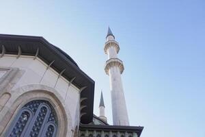 Intricate architecture of a mosque under a clear blue sky photo