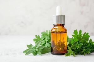 Zero waste lifestyle with DIY concept. Amber glass bottle with dropper surrounded by fresh green herbs on a light background. photo