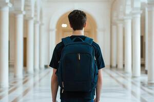 Curriculum higher education with students concept. A person stands in an elegant hallway, wearing a backpack and looking ahead. photo