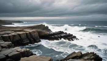Rocky shores with intense waves, set against a dramatic, cloudy sky photo