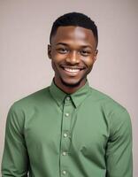Joyful Nigerian man in fashionable clothing, posing with a bright smile in front of a neutral background photo