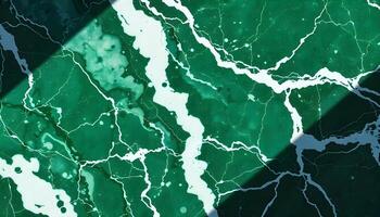 Deep green and white marble texture with bold veins and sharp shadows photo