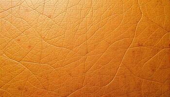 Distressed leather texture with a rugged, weathered look in tan and caramel, showing natural grain patterns photo
