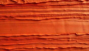 Layered terracotta texture with deep orange, red, and brown shades creating a 3D effect photo