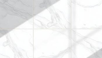 White and gray marble tile, smooth surface with swirling patterns under bright light photo