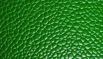 Zoomed in view of a deep green leather grain texture background, capturing the organic fibers and natural variations photo