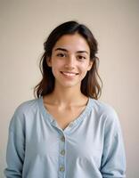 Close up of a smiling Middle Eastern woman with a soft background and medium brown skin photo