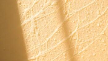 Smooth, creamy yellow background with subtle textured patterns photo