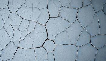 Cracked concrete with irregular patterns and crevices, aged and weathered look photo
