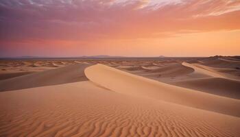 Tranquil desert scene featuring soft sand dunes and a brilliant orange sky at dusk photo
