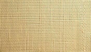Woven fabric or mesh with a uniform grid pattern, made of light colored threads with small square openings photo