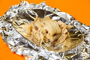 Baked Mushrooms with Butter and Cheese served in plate isolated on orange background side view of hong kong food photo