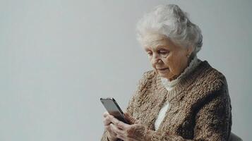 Elderly Woman Engaging with Smartphone for Communication Purpose photo