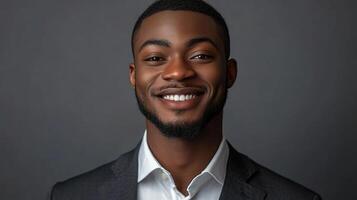 Young Smiling Man in Portrait Close-Up with Handsome Expression photo