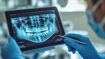 A person is holding a tablet with an x - ray image on it photo