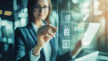 A woman in a business suit is drawing on a screen with icons photo