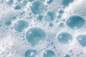 Soap foam texture with bubbles. Abstract background for design. photo