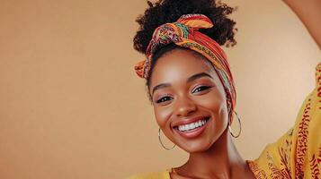 A smiling woman with an afro headband photo