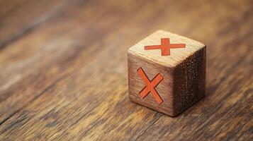 Wooden Cube with Red Marks on Rustic Wooden Surface photo