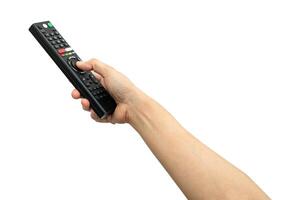 Asian woman use finger of left hand to press button on television remote control isolated on white background with clipping path. photo