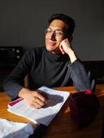 Portrait of a happy and handsome man who looks with sweetness and enjoyment photo