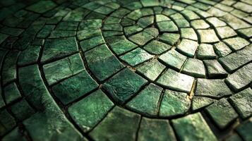 A green stone floor with a circular pattern photo