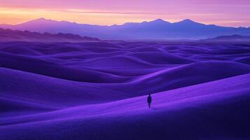 A man standing in the middle of a purple desert photo