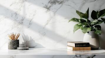 A marble counter with a plant and books photo