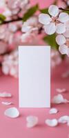 Elegant white greeting card with cherry blossom background for invitations or announcements photo