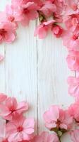 Delicate arrangement of pink sakura petals on rustic white wooden background photo
