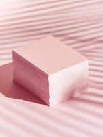 Clean and stylish business card mockup with stack on pink background for professional branding photo