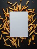 Creative food art with fries surrounding blank page for design inspiration photo