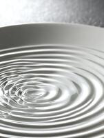 Abstract ripples in water creating a hypnotic circular pattern with soft waves photo