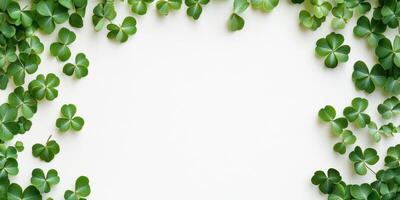 Minimalist clover frame on white background for St. Patricks day designs and decor photo