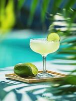 Refreshing summer cocktail with lime and mint by the pool photo