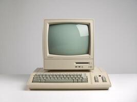 An old computer with a keyboard and monitor photo