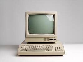 Vintage computer with a beige monitor and keyboard against a minimalistic backdrop. photo