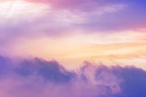 Sunset Sky background,Dramatic clouds, colourful twilight sky in purple, pink, blue, yellow, orange sky in evening Winter.Nature background golden hour of dusk sky photo